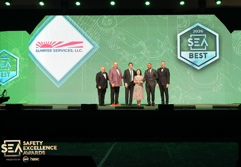 Presenters with Chris Magnus and Phien La on stage at the awards event